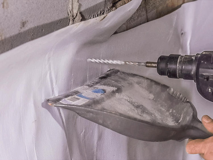 Installing foundation pins for crawl space vapor barrier attachment