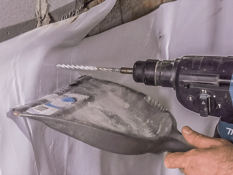 Installing foundation pins for a crawl space vapor barrier